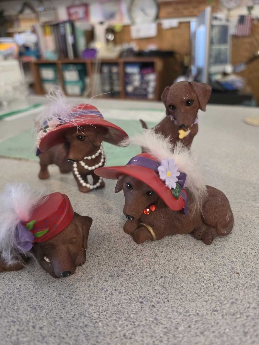 Set of 4 Brown Dachshund Figurines with Red Hats